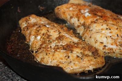 Creole Cast Iron Grouper sizzling in a hot skillet
