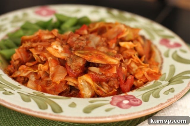 Stuffed Cabbage Casserole A delicious bowl of Stuffed Cabbage Casserole, served alongside crisp green beans, showcasing a healthy and comforting meal option. This low-carb recipe is perfect for weeknight dinners.