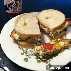 Grilled Zucchini Frittata with Tangy Goat Cheese and Burst Cherry Tomatoes 2 Finished Grilled Zucchini Frittata with Goat Cheese and Cherry Tomatoes, sliced and ready to serve.