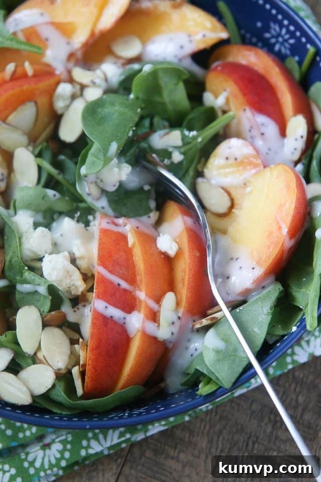 Refreshing Summer Salad: Spinach, Peaches, Gorgonzola, and Toasted Almonds with a light dressing
