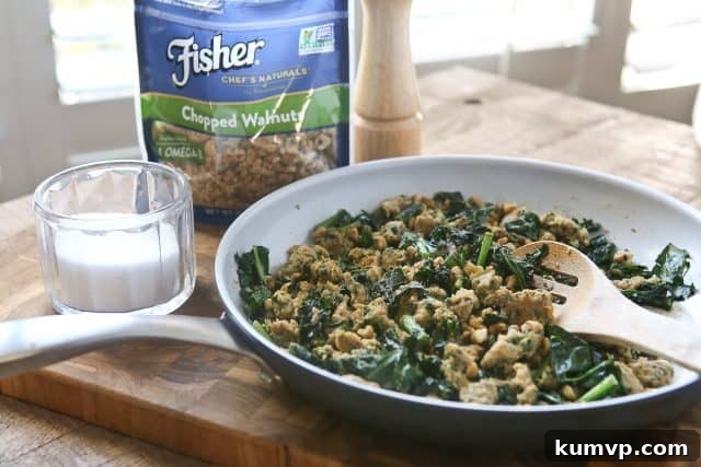 Stuffed Acorn Squash for Easy Entertaining and Healthy Meal Prep Close-up of a Stuffed Acorn Squash half, ready for baking, highlighting the colorful and appetizing filling.