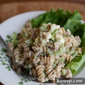 A colorful and creamy tuna pasta salad with Greek yogurt, served in a bowl, ready to be enjoyed.
