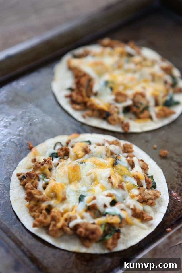 Delicious Turkey and Spinach Baked Tostadas served on a wooden board