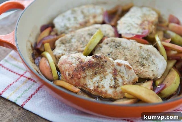 Fall Comfort Food: Hard Cider Skillet Pork Chops with Apples and Onions Beautifully plated Hard Cider Skillet Pork Chops with Apples and Onions, a comforting fall meal ready to enjoy.