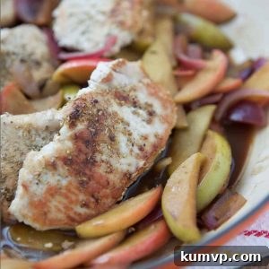 hard cider pork chops with apples in a skillet