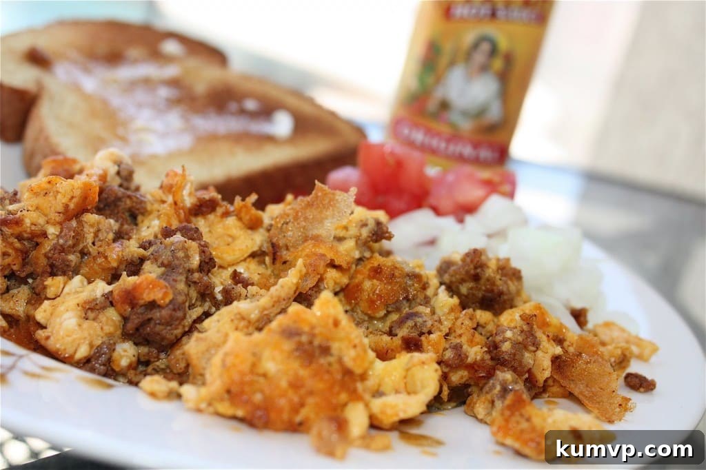 Sizzling Chorizo and Eggs with Fresh Toppings, a Hearty Breakfast