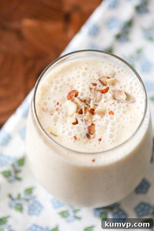 Delicious Almond Peach Kefir Smoothie in a glass, ready to be enjoyed.