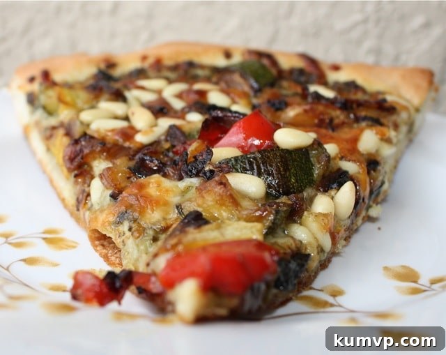 Roasted Vegetable Pesto Pizza Delicious homemade Roasted Vegetable Pesto Pizza, topped with colorful roasted bell peppers, zucchini, squash, onions, fresh pesto, and toasted pine nuts.