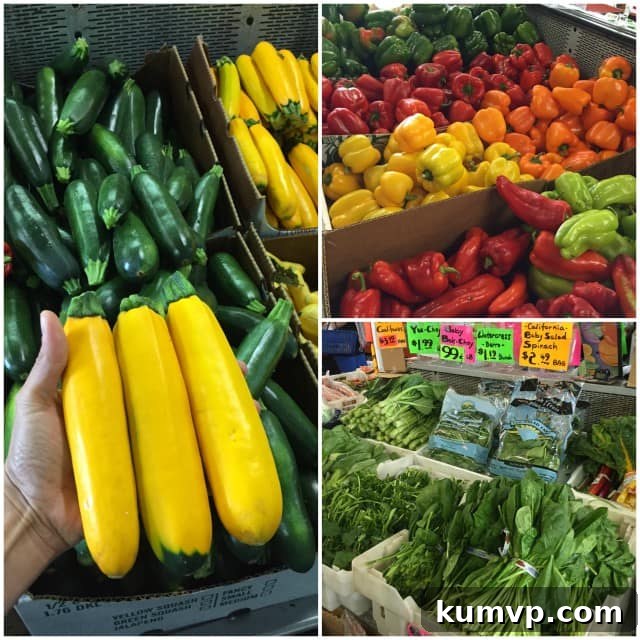 A vibrant display of fresh produce at a farmer's market, featuring various green leafy vegetables, colorful tomatoes, and an assortment of peppers and squashes, highlighting the bounty available for a homemade salsa recipe.